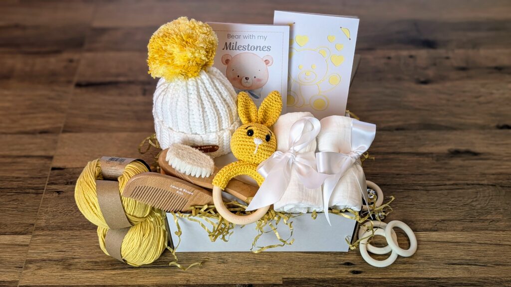 Newborn gift set styled with kraft paper wrapping
