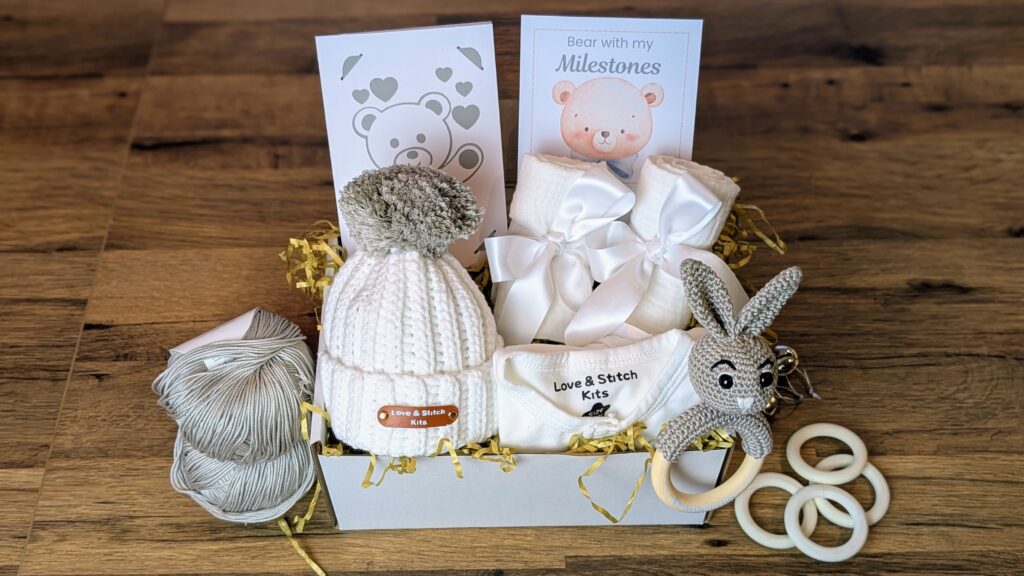 craft-made baby gifts set including rattle, beanie and milestone cards