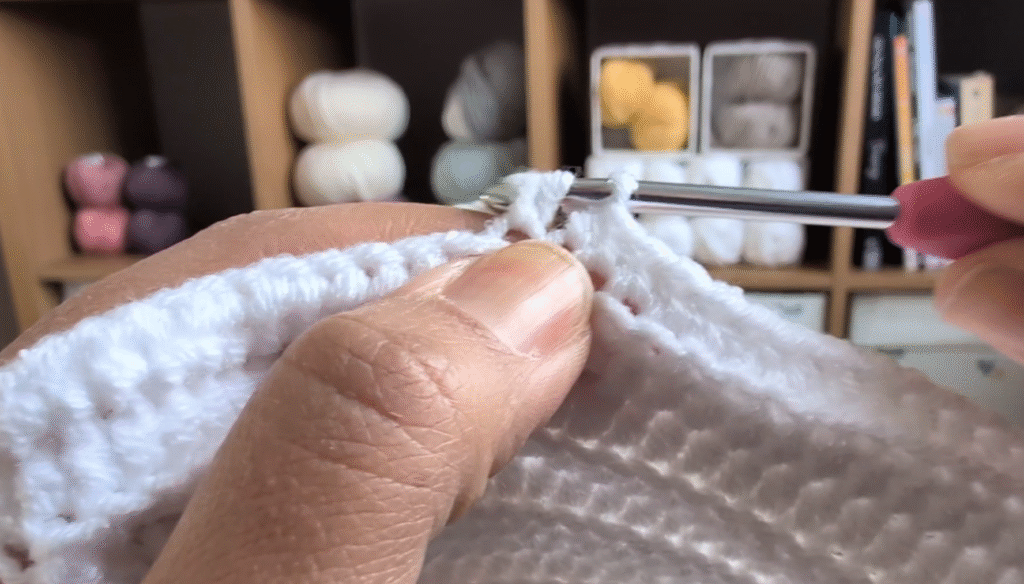 close-up of craft-made baby hat showing craftsmanship and natural materials